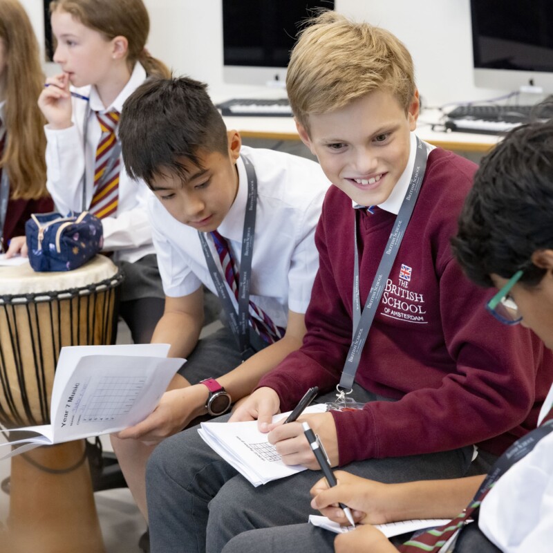 Students taking notes in music class